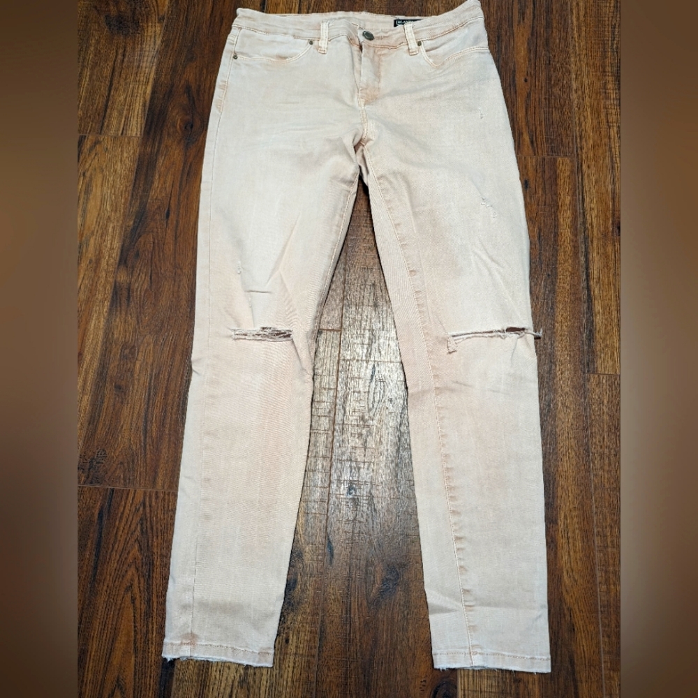 Pink distressed jeans